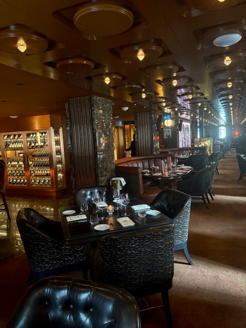 The dining room at Arianna — warm lighting and intimate tables
