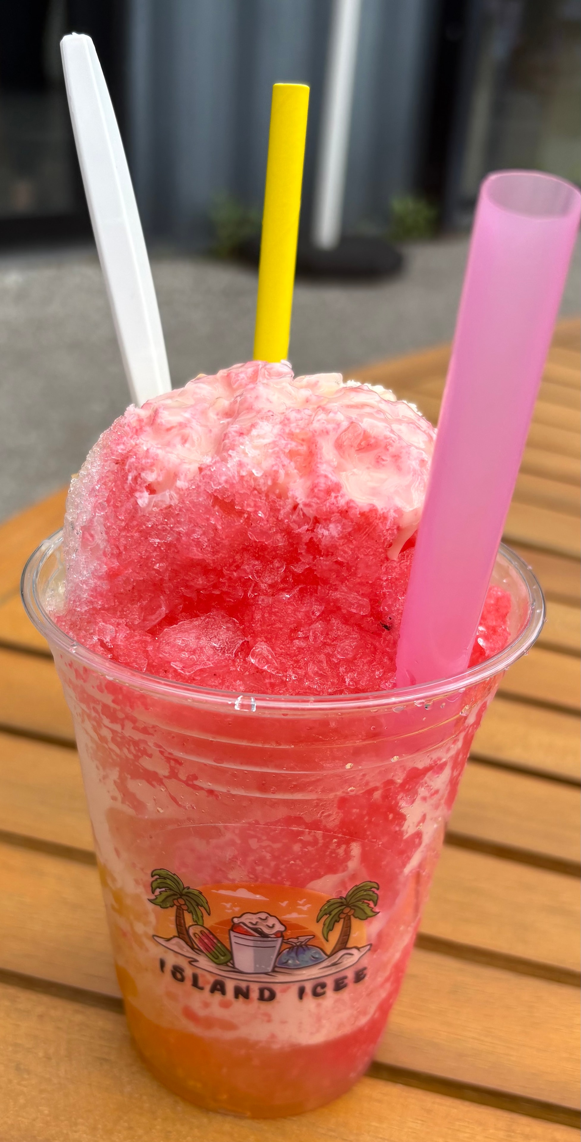 A Taste of Culture — pink shaved ice drink with colourful straws